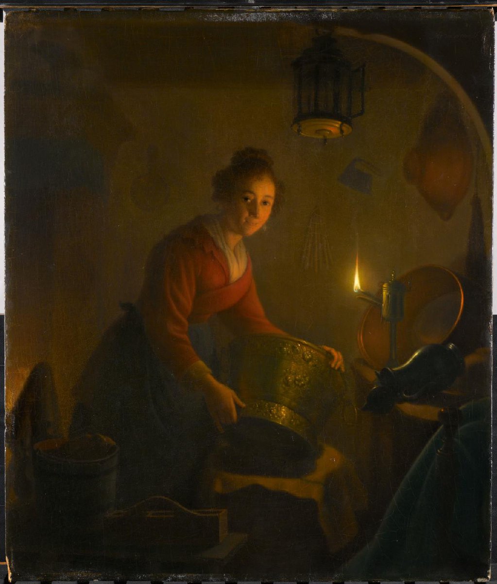 A Woman in a Kitchen by Candlelight